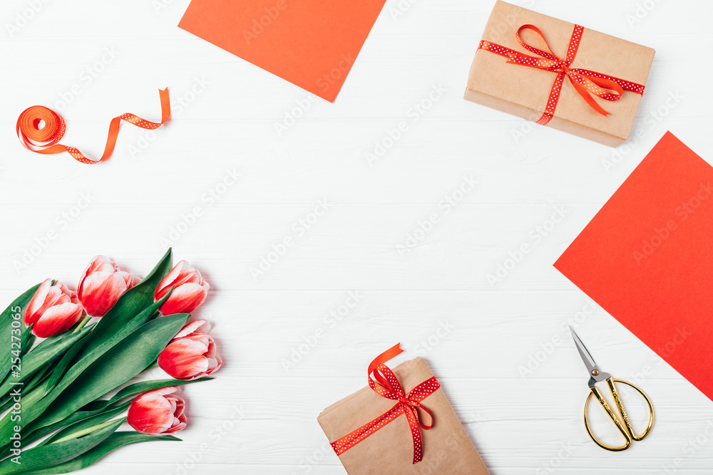 Flat lay frame composition bouquet of red tulips Flat lay frame composition bouquet of red tulips