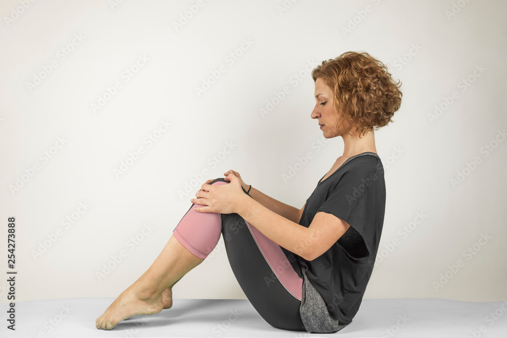 Fototapeta premium Portrait of woman doing workout exercises and training. Yoga.