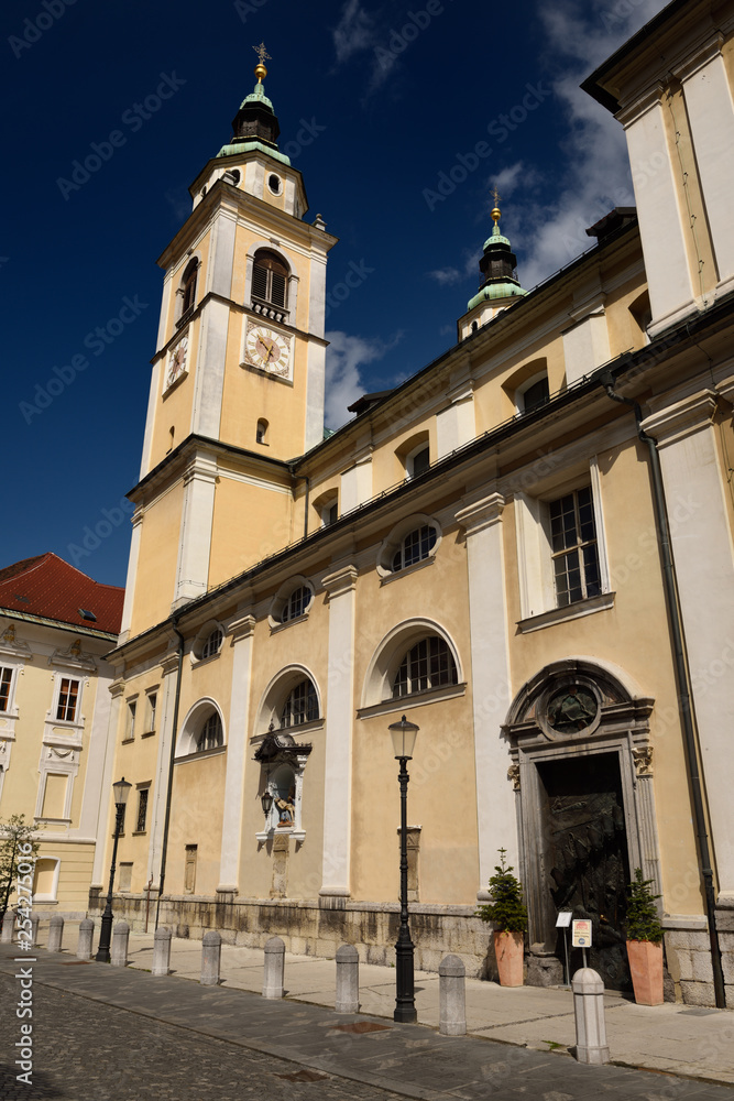 South side of St. Nicholas Catholic church Ljubljana Cathedral with belfry, gothic pieta, door on Cyril Methodius Square Ljubljana Slovenia