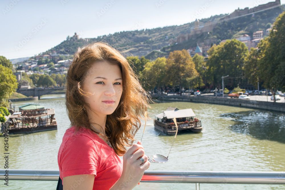 girl with sunglasses on the bridge
