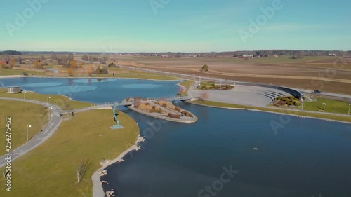 Dji drone flying fast over artificial lake photo