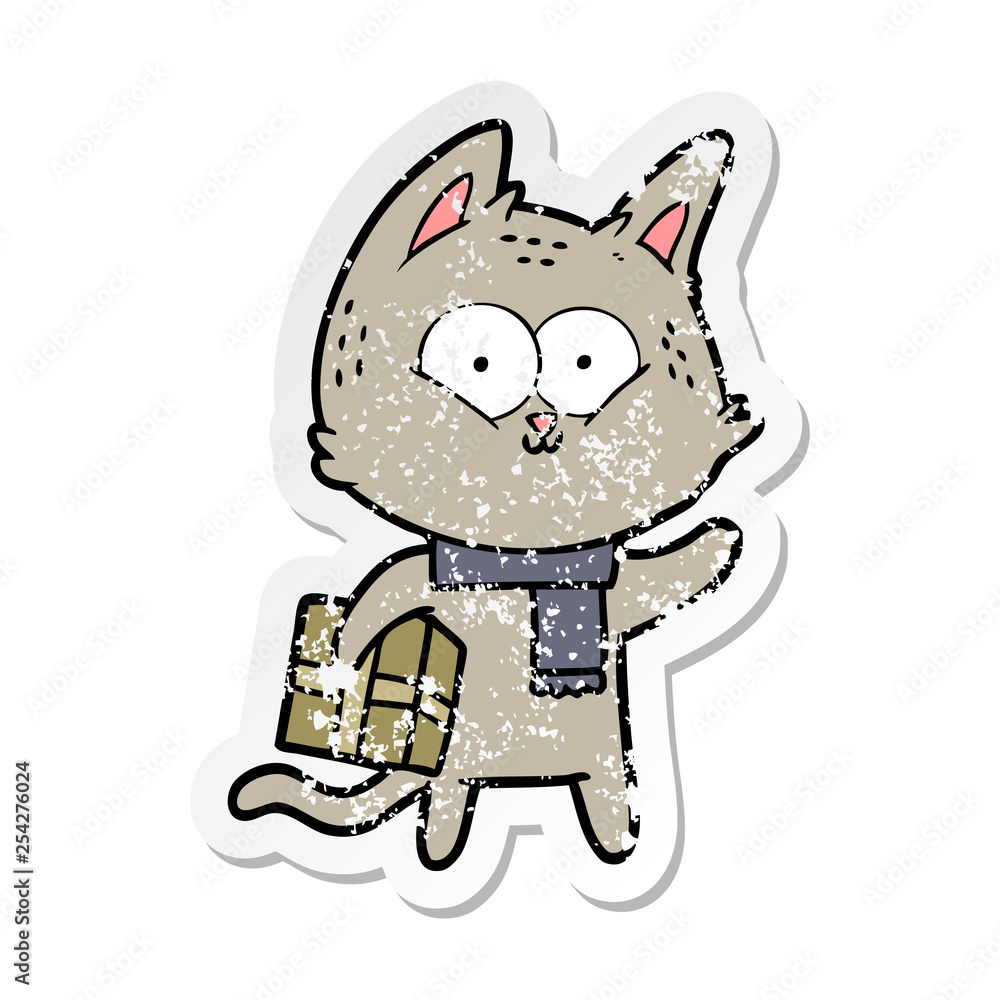 distressed sticker of a cartoon cat holding christmas present distressed sticker of a cartoon cat holding christmas present