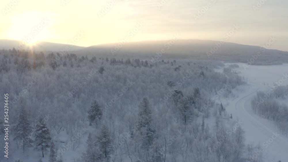 AERIAL : A frozen forest in Swedish lapland with a beautiful sunrise! AERIAL : A frozen forest in Swedish lapland with a beautiful sunrise!