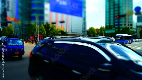 Panning timelapse video of the traffic in Seoul, the capital of South Korea during daytime in miniature effect