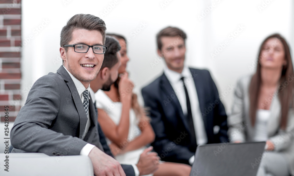 smiling businessman in the workplace smiling businessman in the workplace