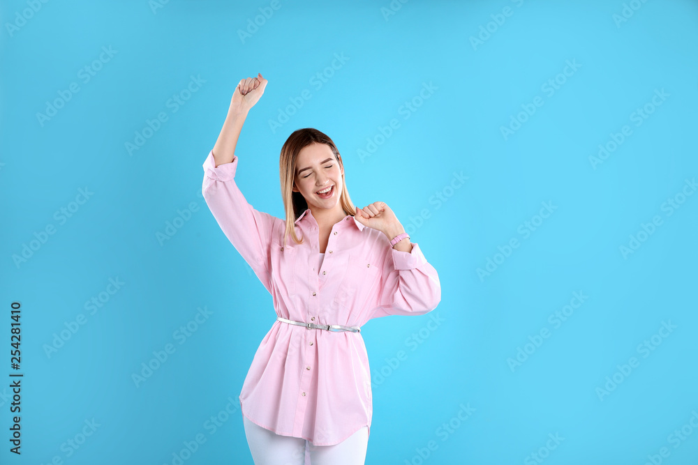Fototapeta premium Portrait of emotional teenage girl on color background