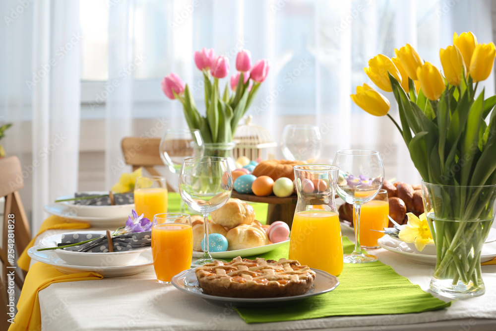 Festive Easter table setting with traditional meal at home Festive Easter table setting with traditional meal at home