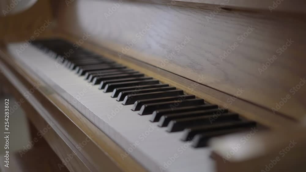 black and white keys of a stand up wooden piano black and white keys of a stand up wooden piano