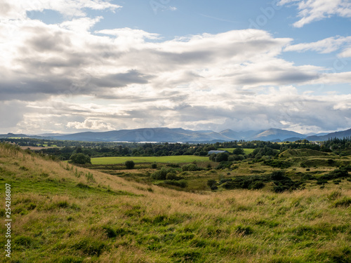 beautiful countryside with mountainrange and meadow