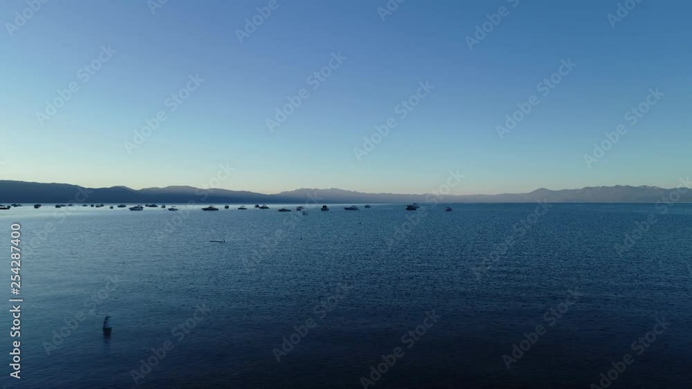 Early Morning Drone flight over moored boats at Kings Beach, Lake Tahoe’s North Shore. Very slow left pan. Early Morning Drone flight over moored boats at Kings Beach, Lake Tahoe’s North Shore. Very slow left pan.