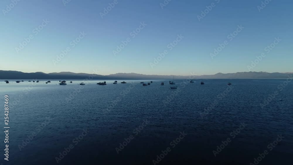 Early Morning Drone flight over moored boats at Kings Beach, Lake Tahoe’s North Shore. Move forward into scene. Early Morning Drone flight over moored boats at Kings Beach, Lake Tahoe’s North Shore. Move forward into scene.