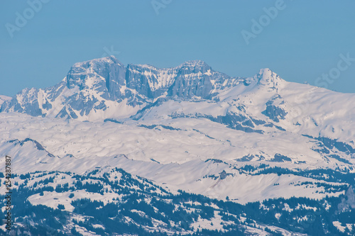 Beautiful panoramic view of snow-capped mountains in the Swiss Alps.