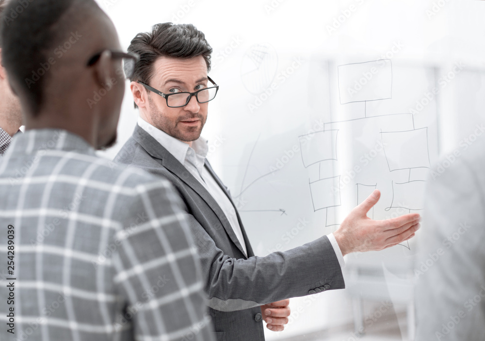 businessman explains something to his business partners businessman explains something to his business partners