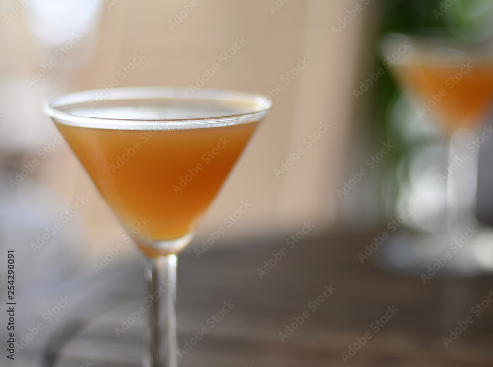 Refreshing ice cold bourbon cocktail in martini glass, very shallow depth of field Refreshing ice cold bourbon cocktail in martini glass, very shallow depth of field