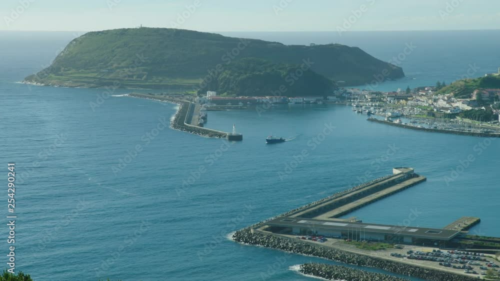 A large fishing boat leaves Horta harbour on a sunny day. The Azores A large fishing boat leaves Horta harbour on a sunny day. The Azores