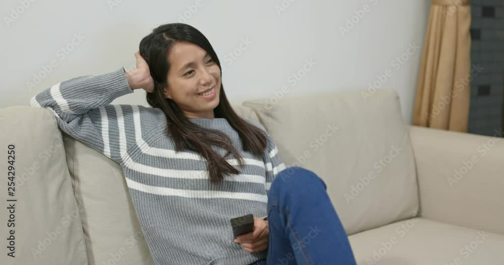 Woman enjoy tv show at home Woman enjoy tv show at home