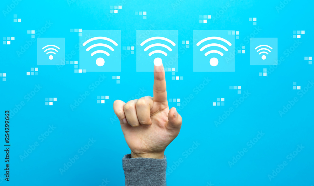 Wifi concept with hand on a blue background Wifi concept with hand on a blue background
