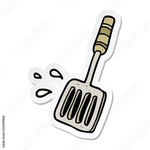 sticker of a cartoon kitchen spatula