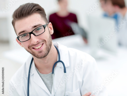 handsome doctor on blurred background