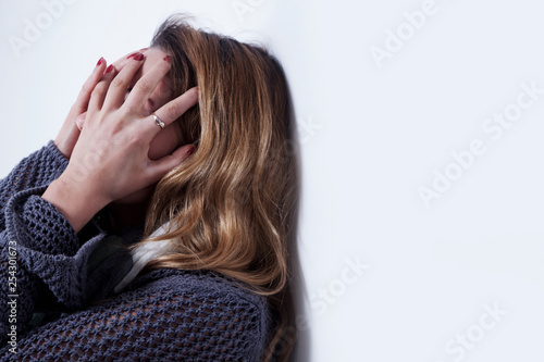 Psychological portrait of sad and depressed woman as symbol of pain and despair.