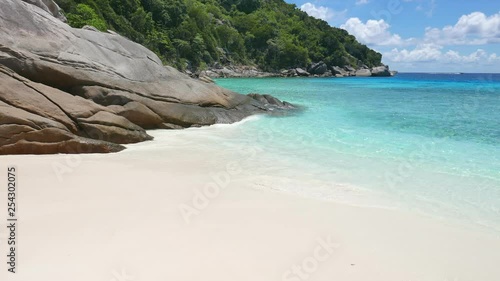 Maldives Island Tropical Sandy Beach with Turquoise Water Rocks and Forest on Beautiful Sunny Day photo