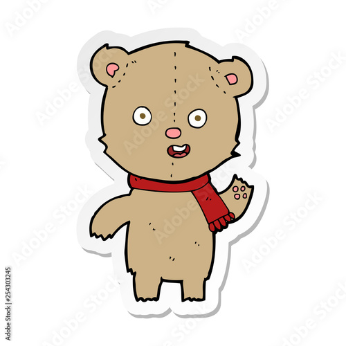 sticker of a cartoon waving teddy bear with scarf