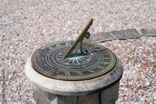 Sundial on a wooden pedestal