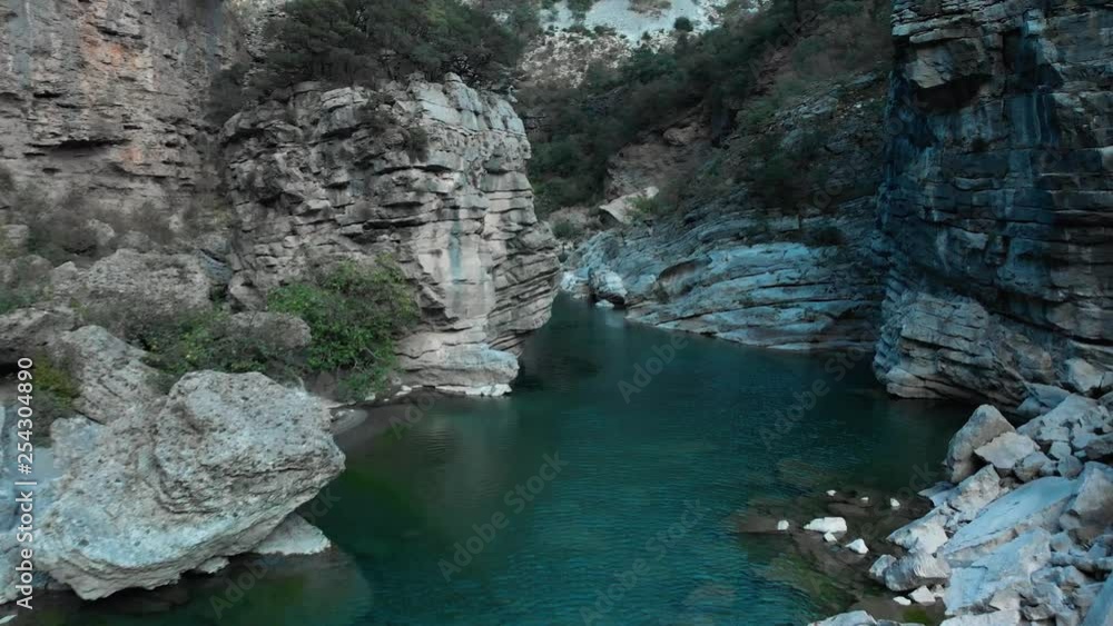 Aerial shot with drone fly between walls of river canyon Aerial shot with drone fly between walls of river canyon