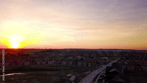 Breathtaking sunset over a small residential community. photo