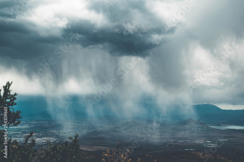 Watching the rain in the city from the mountain