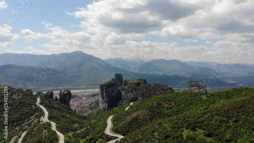 Wide cinematic aerial view of Meteora rock formation and mountains in Greece photo