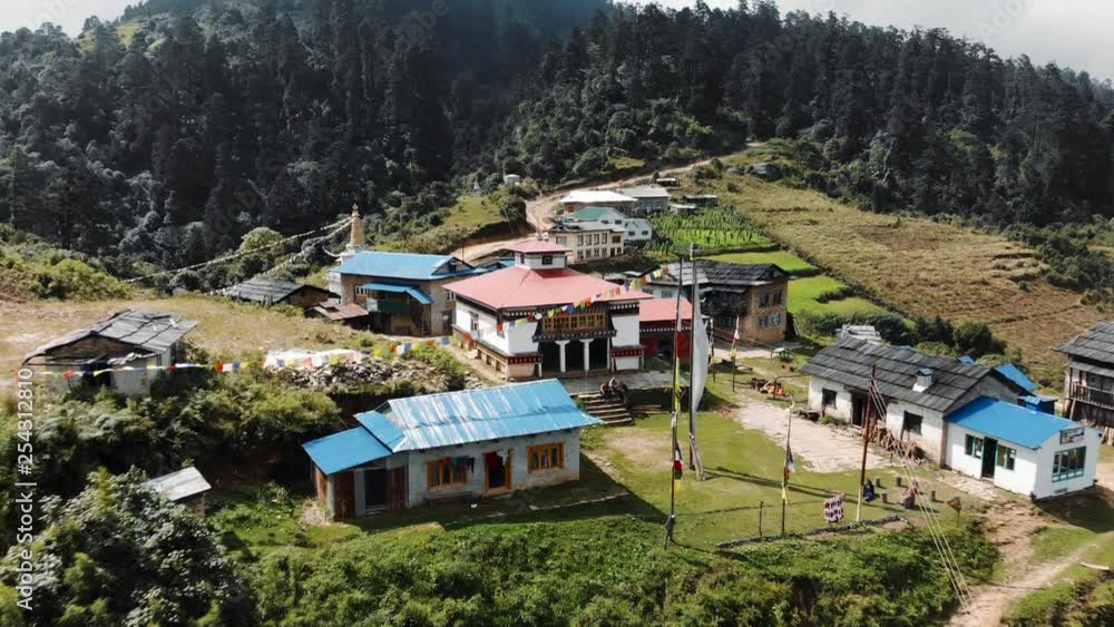 Aerial Reveal of Traditional Buddhist Village with Temple on Hilltop with Green Forest in Nepal - Drone Shot 4K Aerial Reveal of Traditional Buddhist Village with Temple on Hilltop with Green Forest in Nepal - Drone Shot 4K