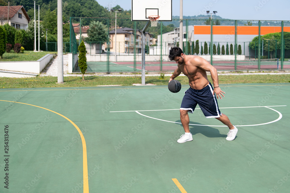 Basketball Player Shooting In A Playground