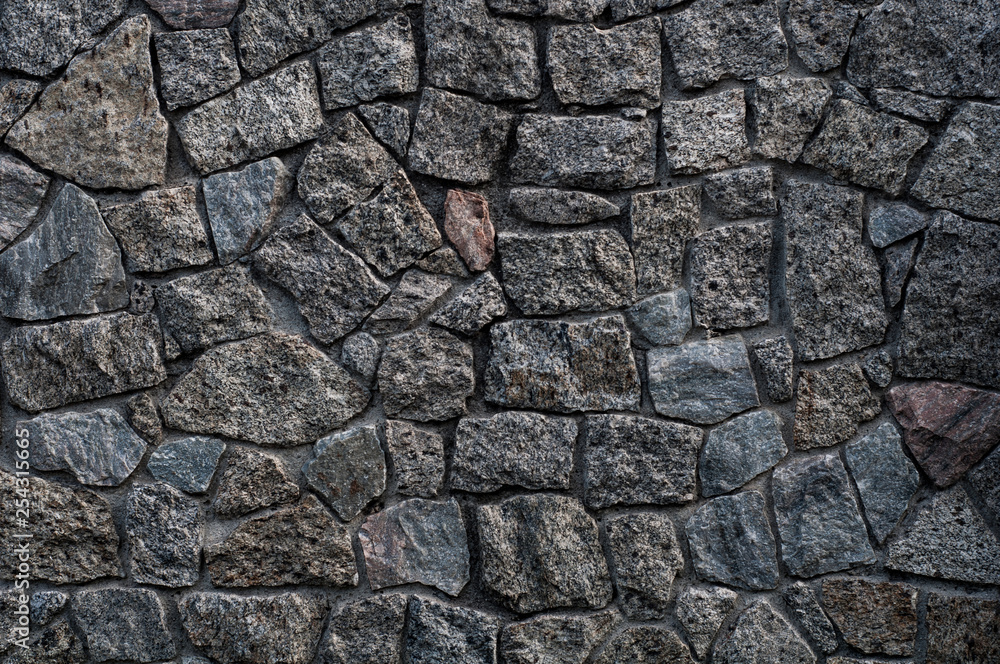 Background texture of old rough granite stones Background texture of old rough granite stones