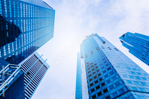 Modern office building skyscrapers, high-rise buildings, architecture raising to the sky, top view background in blue style colors, Concepts of financial, economics, future etc.