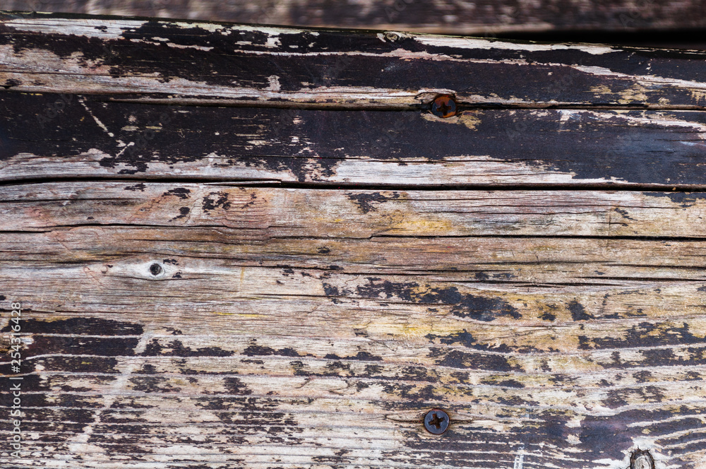 Naklejka premium Textural background of old worn dark pine boards close up