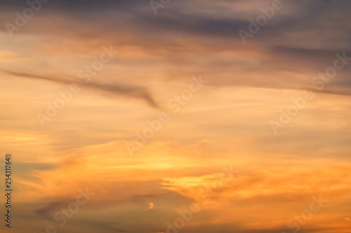 Beautiful stormy natural sunset sunrise sky. Cloudy abstract background, Sun Over Skyline, Horizon. Warm Colours. © TeTe Song