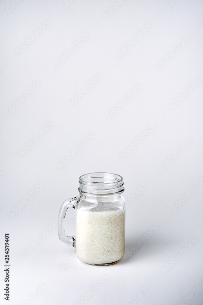 Protein cocktail, smoothie with milk, vanilla in a glass jar with straws. Protein cocktail, smoothie with milk, vanilla in a glass jar with straws.