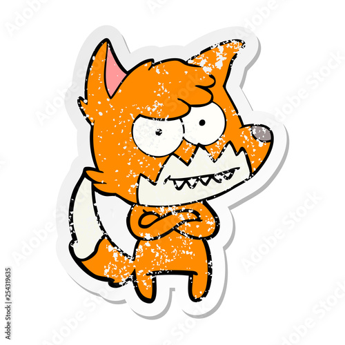distressed sticker of a cartoon grinning fox