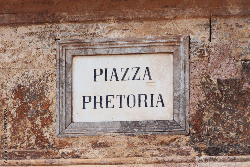 Fototapeta premium Ancient wall plate with name of city square