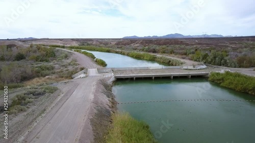 Drone approaching the all American Canal, bridge seen from above.