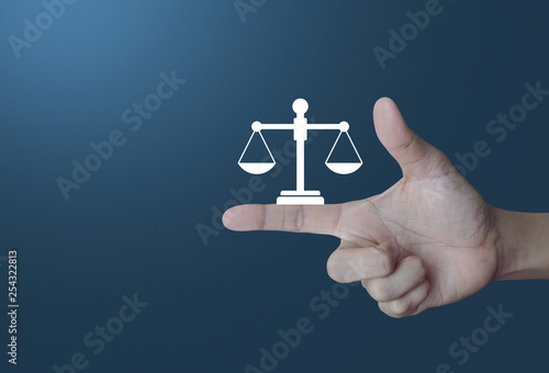 Fototapeta Naklejka Na Ścianę i Meble -  Law flat icon on finger over light gradient blue tone background, Business legal service concept
