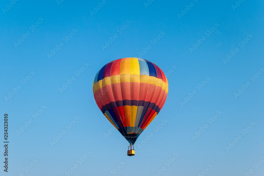 Colorful hot air balloons flying in blue sky Colorful hot air balloons flying in blue sky