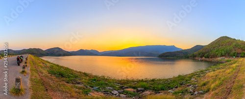 panorama Landscape of sunset on Mountain In the reservoir  Sukhothai,Thailand © rbk365