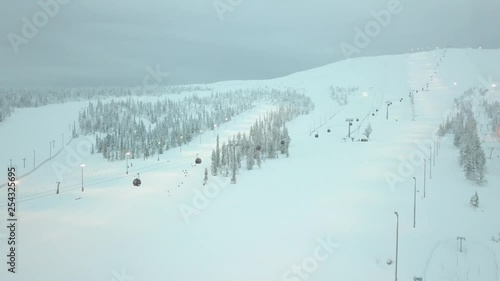 A ski resort in the middle of the winter in Ylläsjärvi, Lapland, Finland. Aerial shots during the day. photo