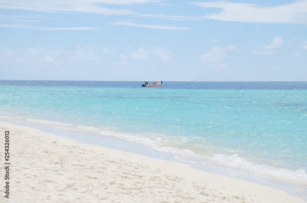 island the beach with white sand and turquoise water with the boat Maldives