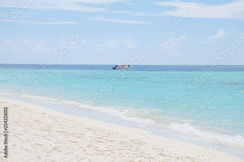 island the beach with white sand and turquoise water with the boat Maldives © rosetata