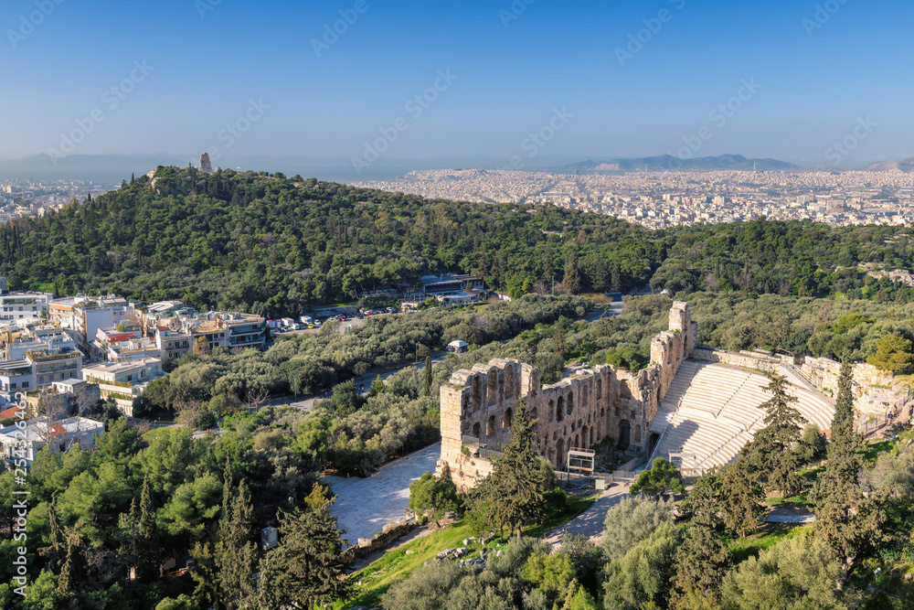 Odeon of Herodes Atticus on Acropolis hill in Athens, Greece with view on the Athens city.