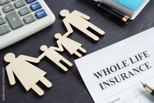 Photography Whole life insurance application form and pen.