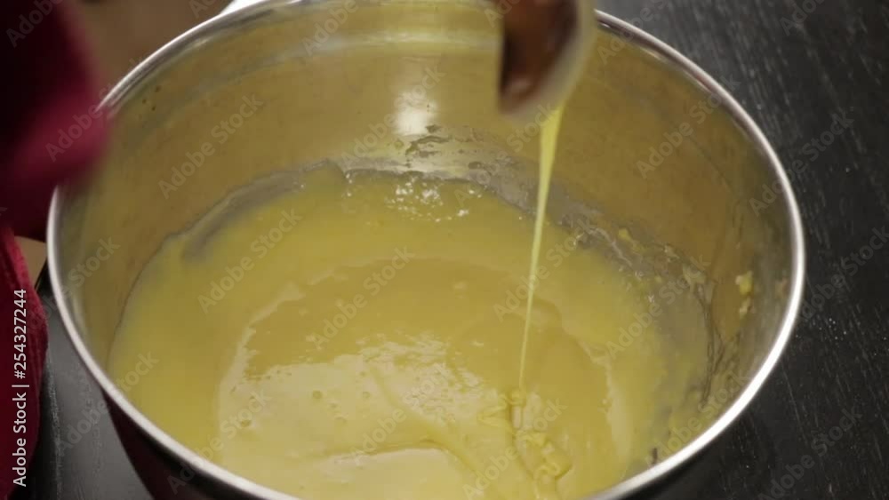 Children making a cake at home, close-up soft focus, slow motion Children making a cake at home, close-up soft focus, slow motion